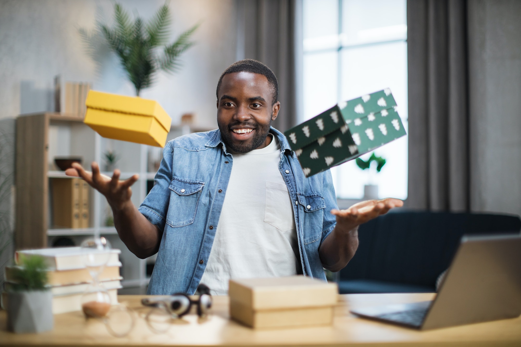 african-influencer-taking-fun-while-unpacking-gift-boxes